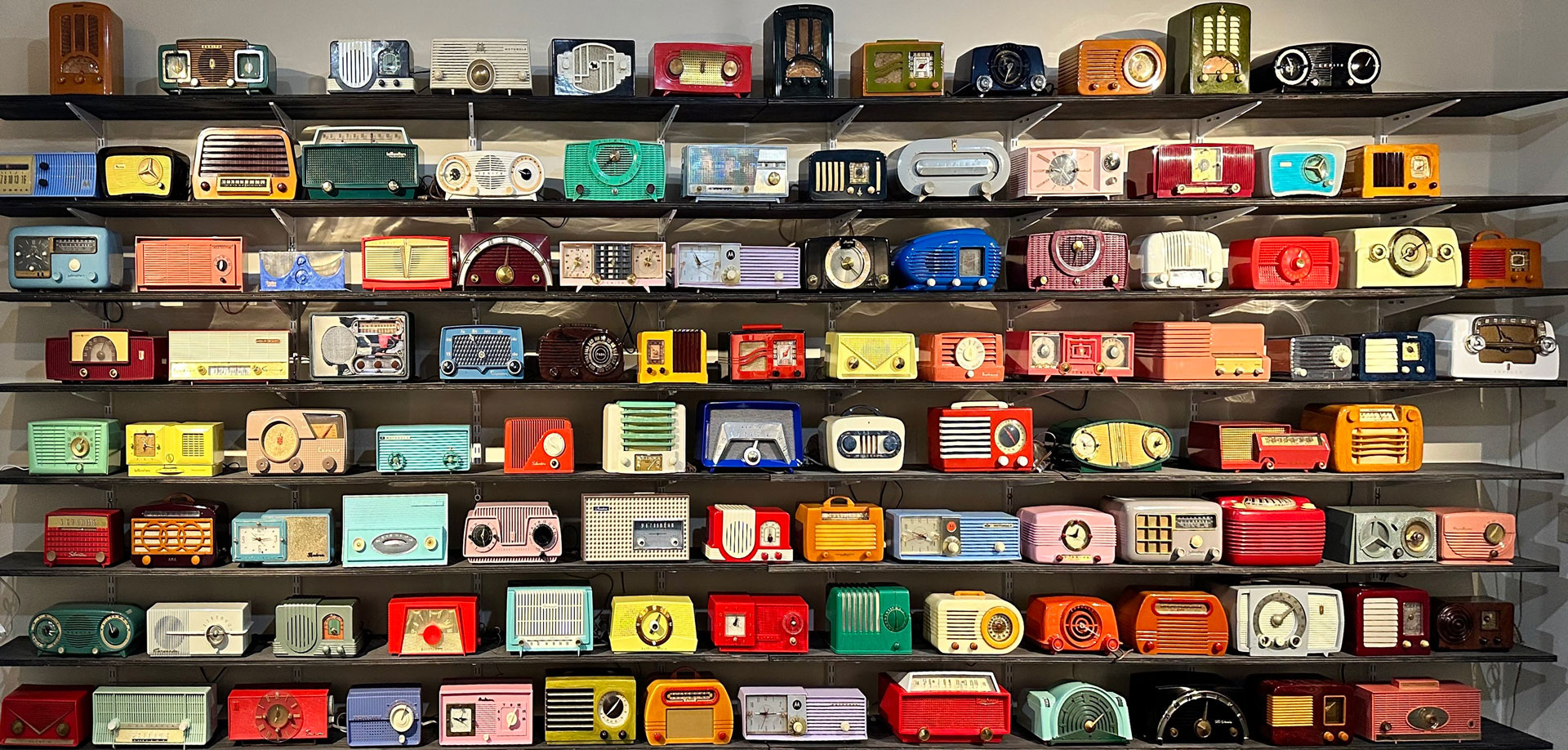 Just Some Radios - Wall of Sound display from TheZevyCollection of plastic, catalin, and bakelite radios of the 1940s and 1950s